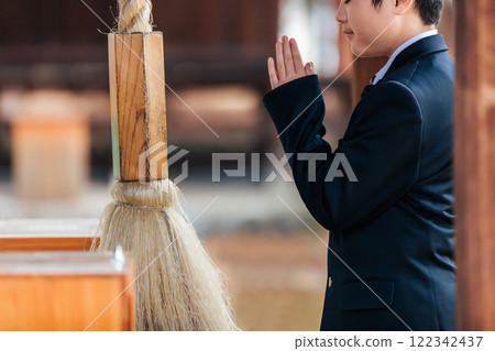 A male student praying for success 122342437
