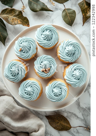 Delicious blue cupcakes decorated with fresh blueberries for autumn celebration 122342998