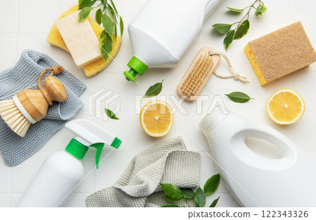 Eco friendly cleaning products promoting sustainable lifestyle with lemons and brushes 122343326