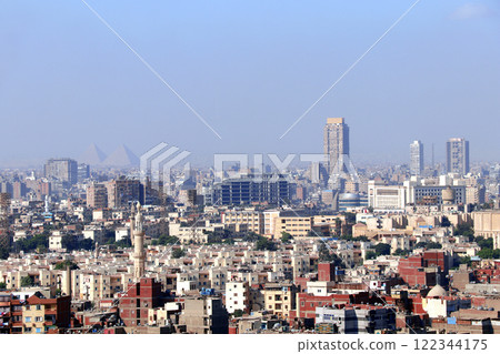Aerial view cityscape of Cairo with residential districts and Great Pyramids. Top view of Cairo, capital of Egypt. High angle view from the Cairo Citadel 122344175