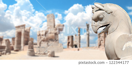 Horizontal banner with stone statue of mythical creature griffin and columns of Apadana Palace at the Persepolis, Iran. Topic of summer vacation, travel, trip abroad on vacation, cruises and tours Horizontal banner with stone statue of mythical creature griffin and columns of Apadana Palace at the Persepolis, Iran. Topic of summer vacation, travel, trip abroad on vacation, cruises and tours 122344177