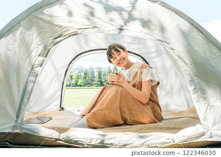 Child/girl in tent at camp Child/girl in tent at camp 122346030