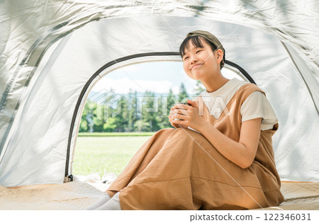 Child/girl in tent at camp 122346031
