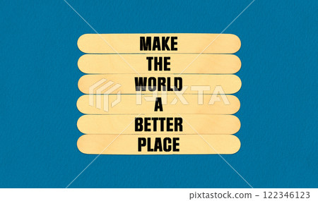 Make a Better World Symbol. Concept word Make The World A Better Place on beautiful wooden stick. Beautiful Blue Chart Paper Background. Business and Make a Better World concept. Copy space 122346123