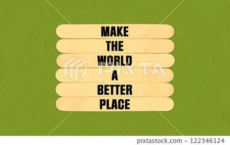 Make a Better World Symbol. Concept word Make The World A Better Place on beautiful wooden stick. Beautiful Green Chart Paper Background. Business and Make a Better World concept. Copy space 122346124