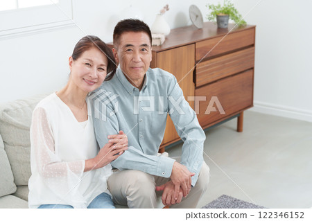 Smiling senior couple in a room Smiling senior couple in a room 122346152