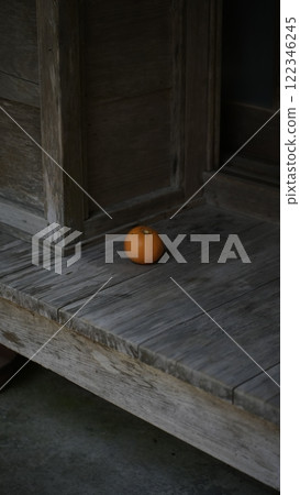 Oranges placed on the veranda of an old house Oranges placed on the veranda of an old house 122346245