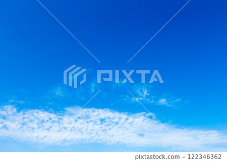 blue sky background with tiny clouds 122346362
