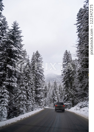 Car on Snowy Mountain Road Car on Snowy Mountain Road 122347275