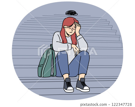 Teenage woman cries because bullying or harassment and sits on steps suffering from social problems 122347728
