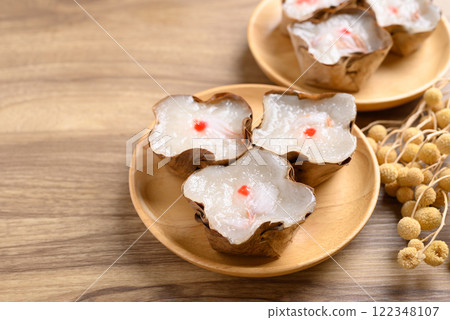 Sticky rice cake with coconut filling on wooden background, Chinese New Year cake 122348107