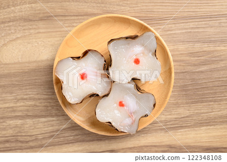 Sticky rice cake with coconut filling on wooden background, Chinese New Year cake 122348108