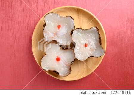 Sticky rice cake with coconut filling on red background, Chinese New Year cake 122348116