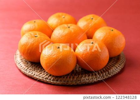 Mandarin tangerine orange fruit on red background, Lucky food in Lunar New Year or Chinese New Year 122348128