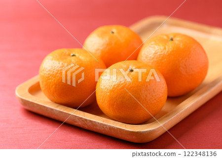 Mandarin tangerine orange fruit on red background,Lunar New Year or Chinese New Year 122348136