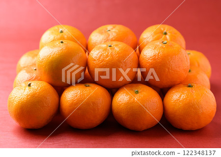 Mandarin tangerine orange fruit on red background, Lucky food in Lunar New Year or Chinese New Year 122348137