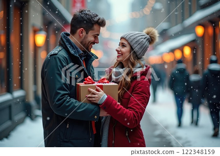 young loving couple with a gift box on valentines day outdoors 122348159