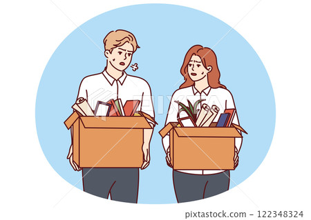 Dismissed man and woman with boxes leave workplaces after reduction of company staff due to crisis 122348324