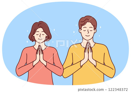 Praying man and woman fold palms in front of chests for joint prayer and religious ritual 122348372