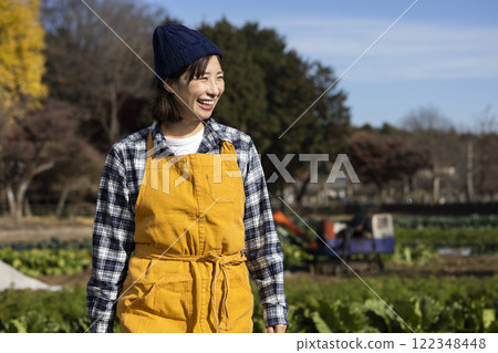 Scene of a woman working in the fields Scene of a woman working in the fields 122348448
