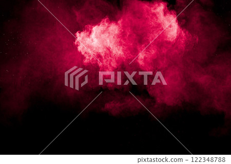 A red cloud of powder on black background. 122348788