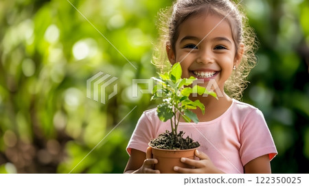 Happy Girl Holding a Potted Plant in a Vibrant Green Garden 122350025