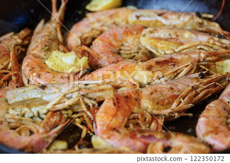Fried langoustines with Lemon Pepper Butter. Fried shrimps. 122350172