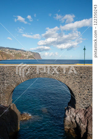 Stone bridge and Atlantic ocean, Madeira, Portugal Stone bridge and Atlantic ocean, Madeira, Portugal 122350243