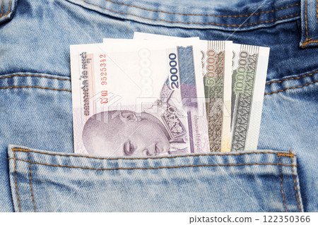 Cambodian riel in the pocket of blue jeans 122350366