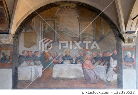 San Dominic in Mensa fed by the Angels, fresco by Santi di Tito in the cloister of Santa Maria Novella Principal Dominican church in Florence, Italy 122350528