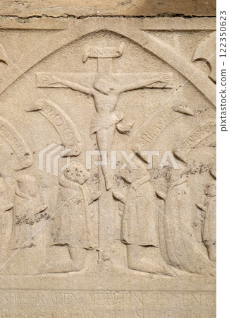 Crucifix, bass relief on the facade of Cathedral of Saint John The Baptist, Slomsek square, Maribor, Slovenia Crucifix, bass relief on the facade of Cathedral of Saint John The Baptist, Slomsek square, Maribor, Slovenia 122350623