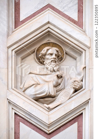 Saint Matthew the Evangelist, relief on the facade of Basilica of Santa Croce (Basilica of the Holy Cross) - famous Franciscan church in Florence, Italy 122350895