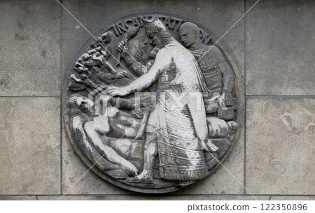Incantation. Stone relief at the building of the Faculte de Medicine Paris, France. 122350896