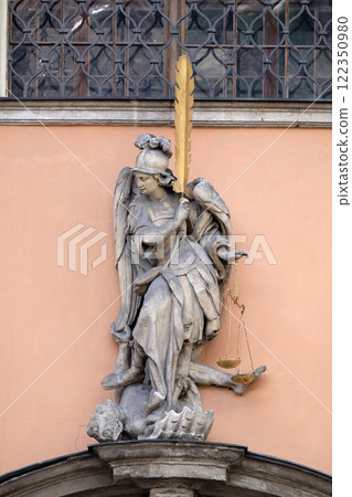 Archangel Michael on the portal of Dreifaltigkeitskirche ( Holy Trinity ) church in Graz, Styria, Austria Archangel Michael on the portal of Dreifaltigkeitskirche ( Holy Trinity ) church in Graz, Styria, Austria 122350980