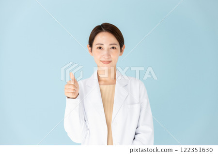 White coat woman thumbs up 122351630