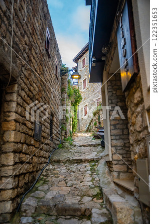 Narrow street in Ulcinj Old Town in Montenegro, the southernmost city at Montenegrin coast, Europe Narrow street in Ulcinj Old Town in Montenegro, the southernmost city at Montenegrin coast, Europe 122351653