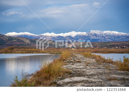 Landscape view of Salina nature park with flamingos near Ulcinj town in winter time in Montenegro 122351666