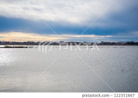 Landscape view of Salina nature park with flamingos near Ulcinj town in winter time in Montenegro 122351667