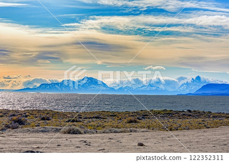 Panoramic view of Lago Viedma near El Chalten in Patagonia against backlight with distant mountains 122352311