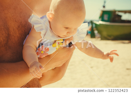 Closeup of little baby in parent hands. 122352423