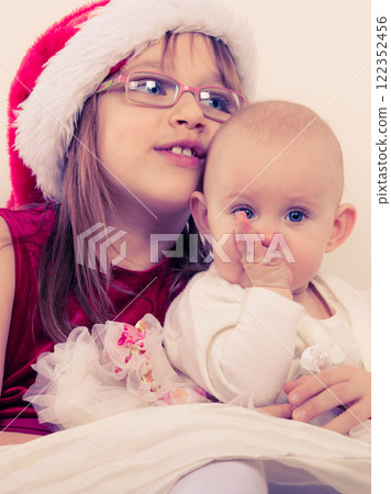 Two beautiful sisters together. 122352456