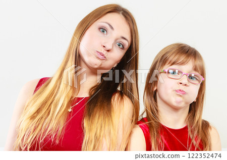 Mommy and daughter having fun 122352474