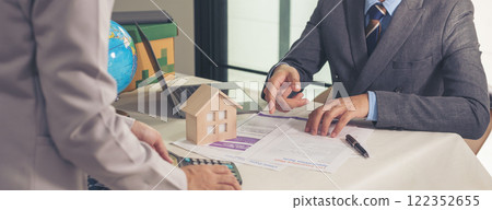 Banner Businessman real estate house agent team businessperson. Manager selling house real estate agent at office desk. Businessman working home insurance mortgage sale apartment with copy space Banner Businessman real estate house agent team businessperson. Manager selling house real estate agent at office desk. Businessman working home insurance mortgage sale apartment with copy space 122352655