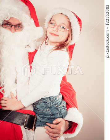 Santa claus with little girl. Santa claus with little girl. 122352682