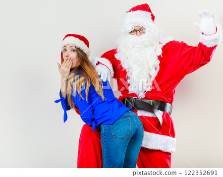 Attractive lady with Santa Claus. 122352691