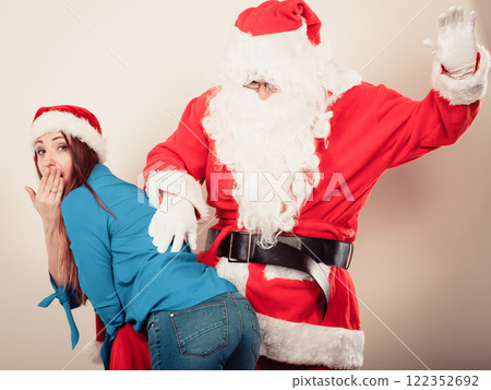 Attractive lady with Santa Claus. Attractive lady with Santa Claus. 122352692