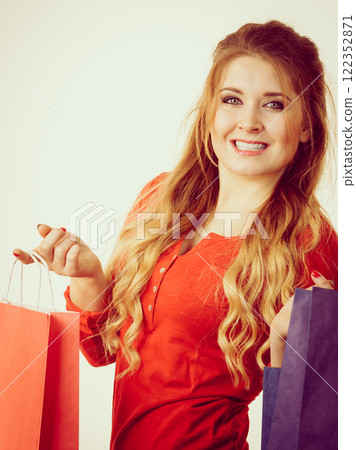 Happy woman with shopping bags Happy woman with shopping bags 122352871