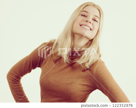 Woman wearing suede top golf 122352876