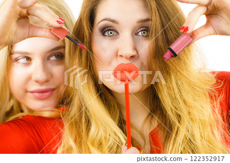 Two women and lip product 122352917