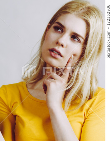 Young woman thinking seeks solution. Young woman thinking seeks solution. 122352936